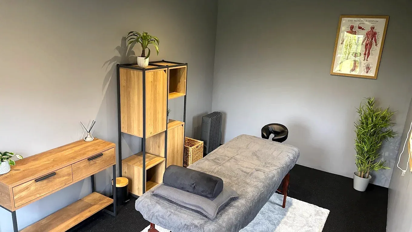 Private massage and recovery treatment room in Lurgan with treatment couch and equipment